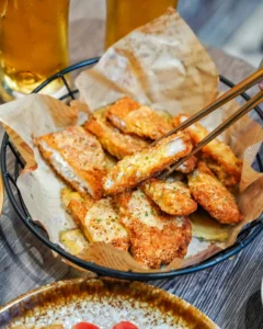 Golden crispy baked chicken cutlets on a plate