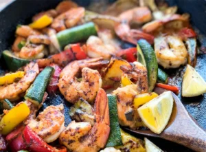 Delicious Chicken and Shrimp Recipes featuring a variety of cooking styles and colorful accompaniments.